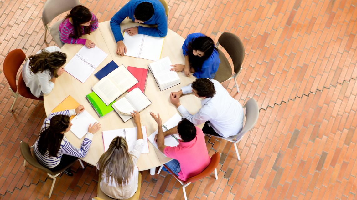 Study,Group,With,Young,People,Sitting,In,A,Round,Table